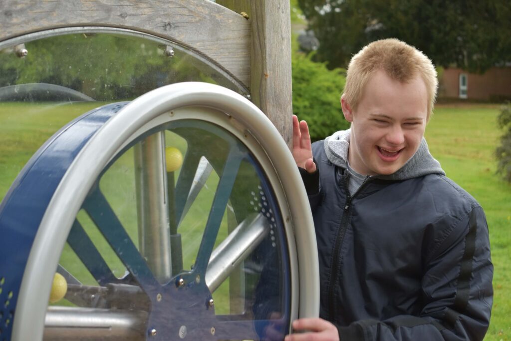 boy rolling a wheel