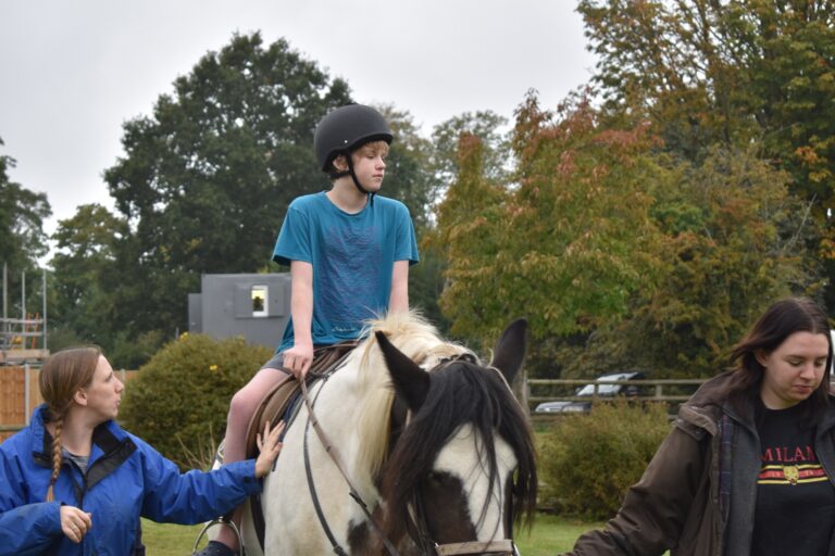 Boy riding horse