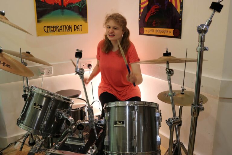 girl playing the drums