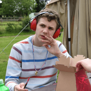 boy with medal around his neck and headphones on