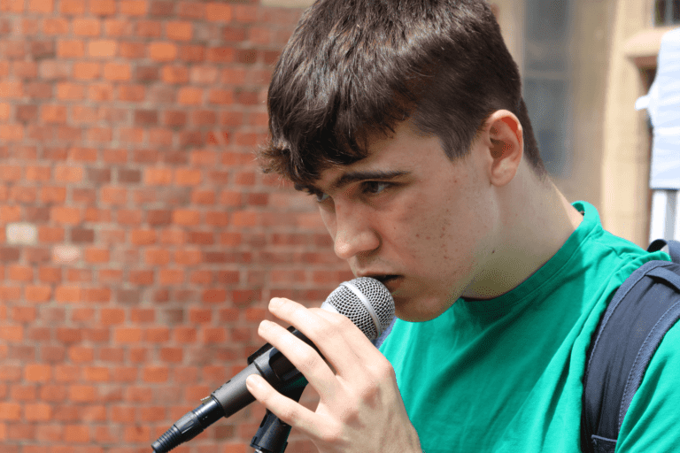 boy singing into mic