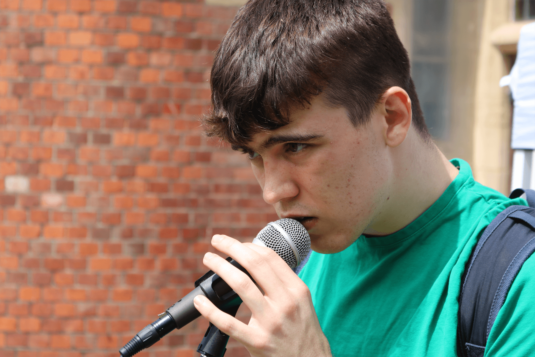 boy singing into mic