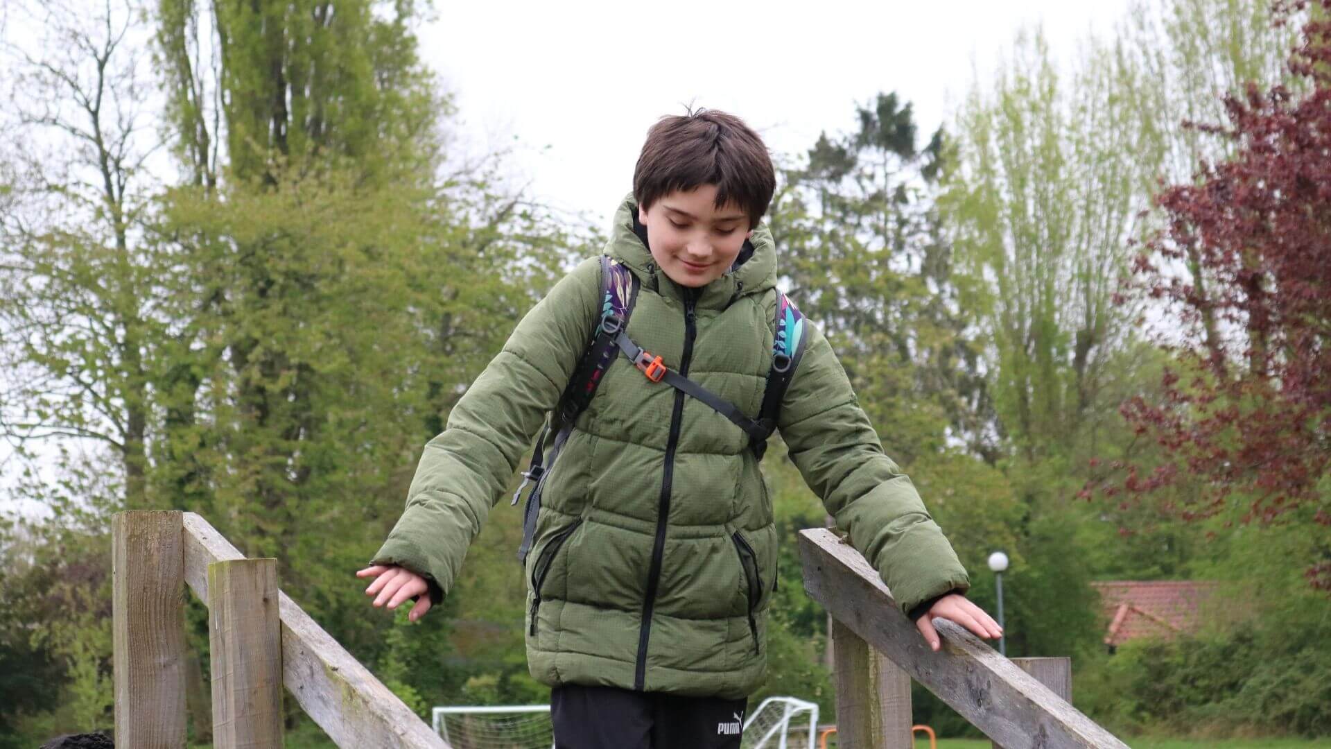 Smiling student during an outdoor activity at The Loddon School