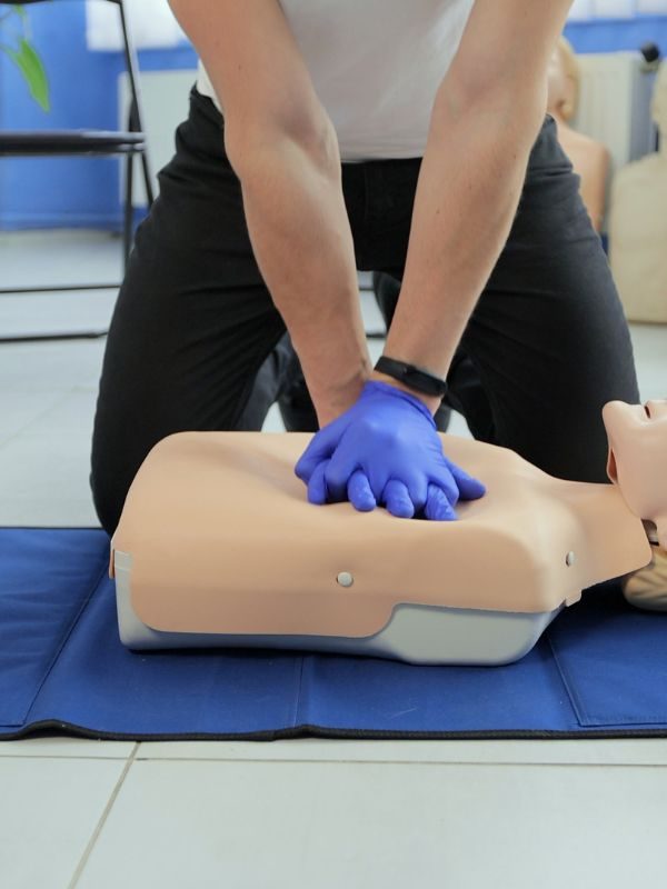 Instructor demonstrating CPR during SEN-focused first aid training session