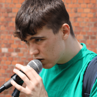 boy singing into mic
